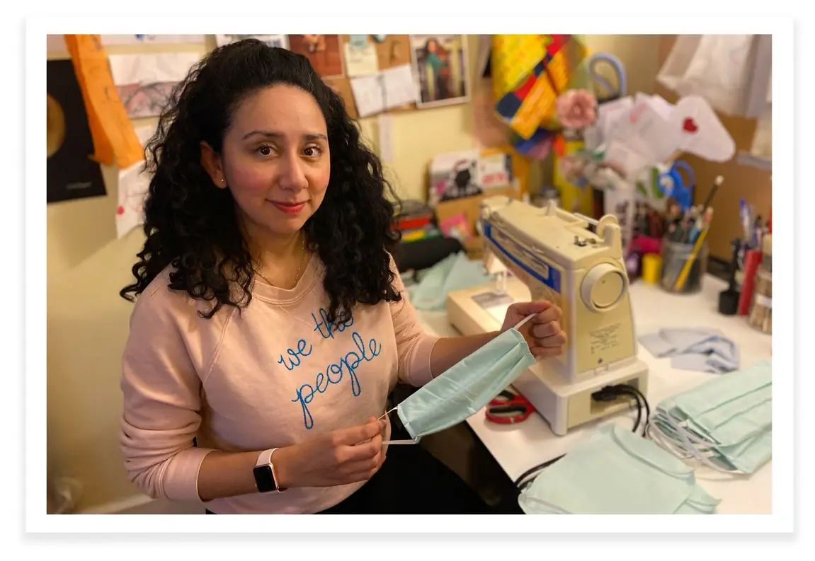 Designer Veronica Morales poses with one of her homemade face masks.