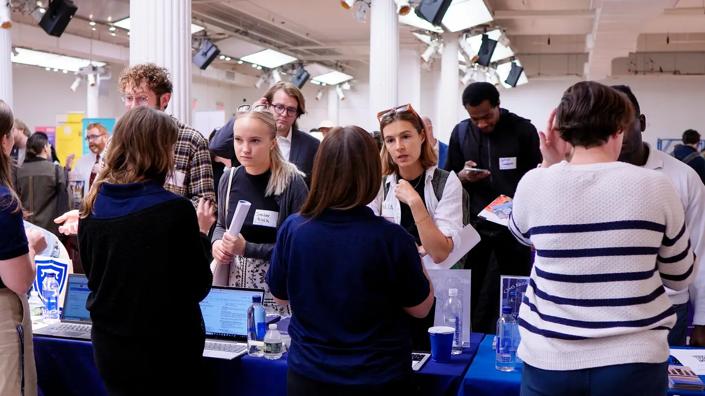 University recruiter speaking to Idealist Grad School Fair attendees.