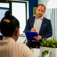 Employees engaged in a meeting.