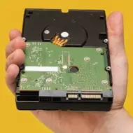 hand holding hard drive