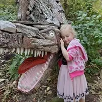 Eva with T-Rex by Joe Treat at Price Sculpture Forest