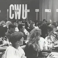 A black and white photo of students in an auditorium at CWU.