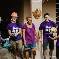 Volunteers on a build site with homeowner