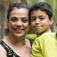 Mother with three children smiling