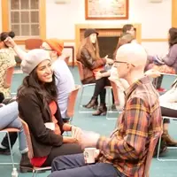 Participants engaging in one-on-one dialogue at Dialogue Nights