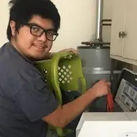 Mychal's Learning Place student learning to do laundry