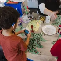 Students work on holiday art projects.