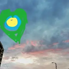 A painting of the Idealist logo in the sky.