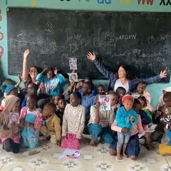 Children with Volunteers in classroom