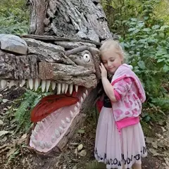 Eva with T-Rex by Joe Treat at Price Sculpture Forest