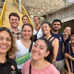 A group of volunteers in front of the classroom