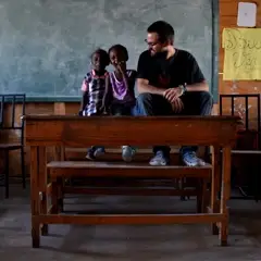 Professional volunteer with students in Haiti