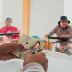 A group of women is taking part in a group session talking about trauma