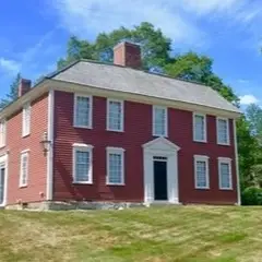 Red, colonial-era, two-story building