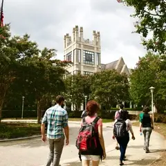 Students walk toward the Sanford building.