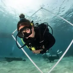 Intern performing buoyancy games underwater