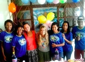 A group of people smiling with balloons.