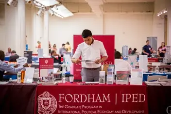 A photo of the Fordham University booth at an Idealist Grad School Fair.