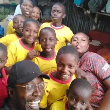Visitors taking a selfie with some of our children