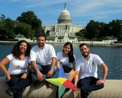 A group of people smiling and posing.