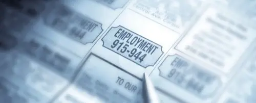 Close up of an ad for employment in a newspaper.