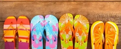 Four different colored flip flops.