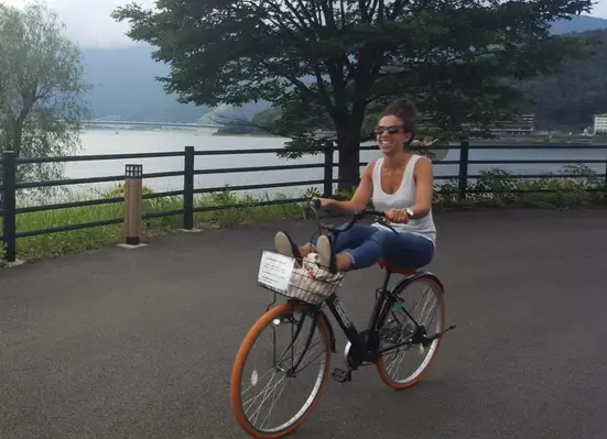 A woman riding a bicycle.