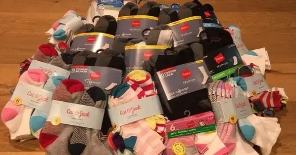 A photograph of various clean and new socks being donated for a sock drive, hosted by Dori C.