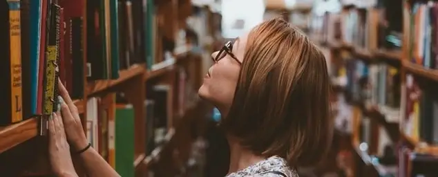 woman looking at books