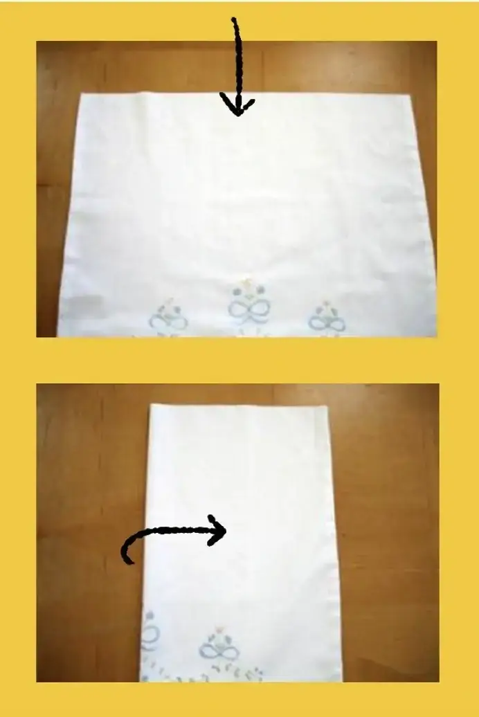 An image showing a pillowcase laid out flat with the closed end at the top, possibly with some creases. The pillowcase is folded in half lengthwise.