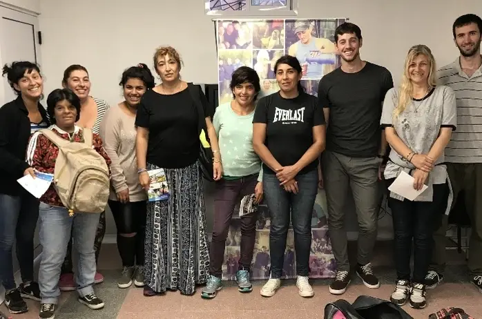 A group of people posing and smiling.