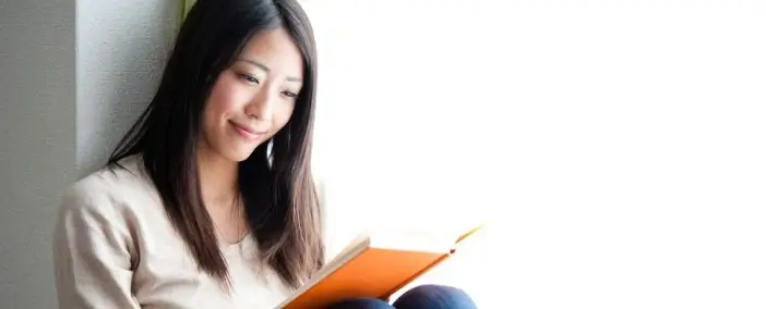 A woman reading a book.