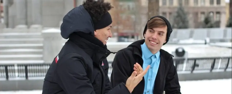 Two people sitting and talking.