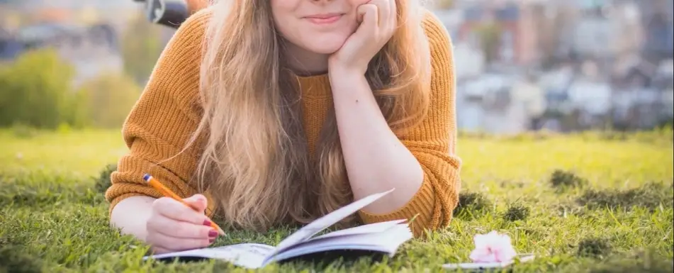 A woman writing in her notebook.