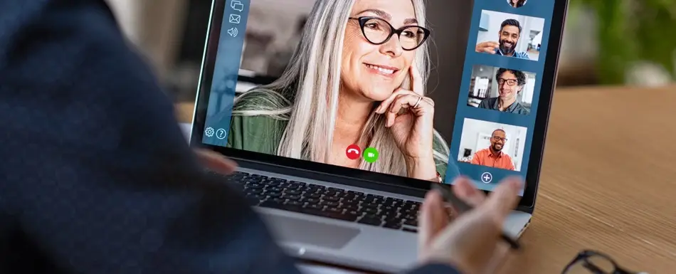 Someone on a group video call on their laptop