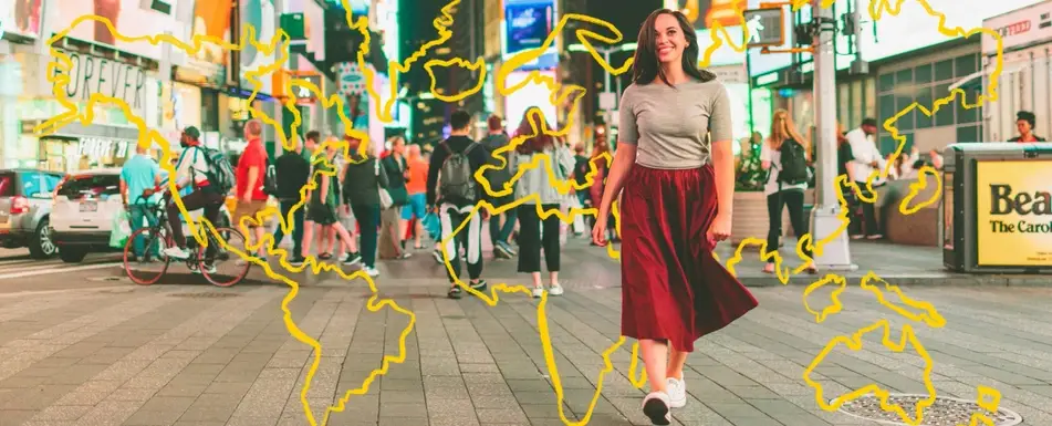 A smiling woman gliding confidently gliding through Times Square.