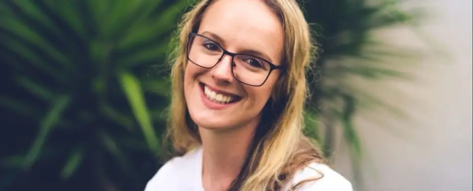 A woman smiling at the camera.