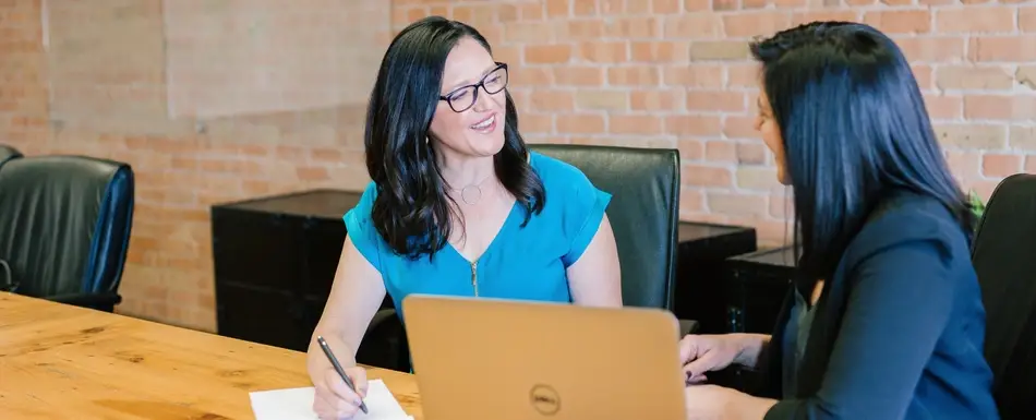 two women in a meeting