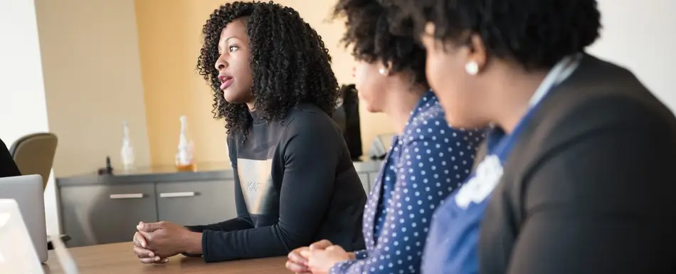 women talking in a meeting