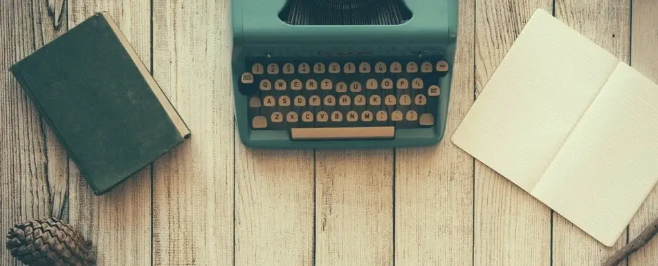 A typewriter and two notebooks.