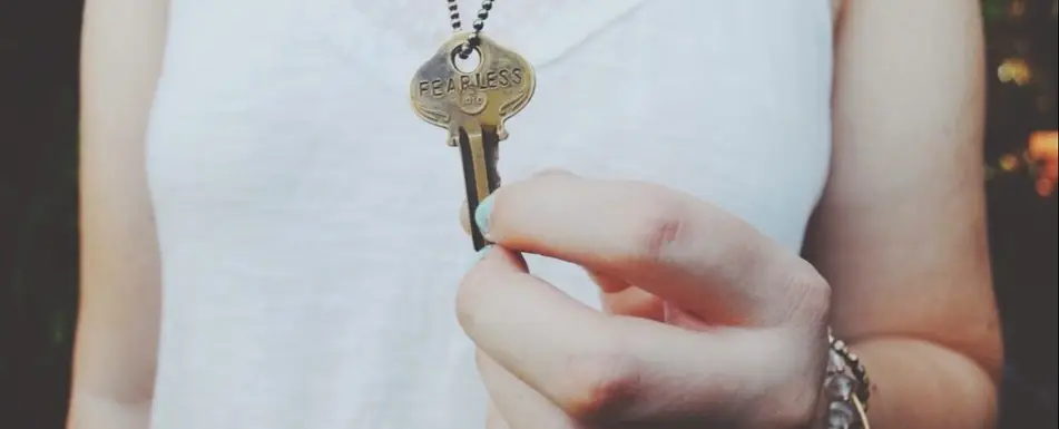A person holding a key.