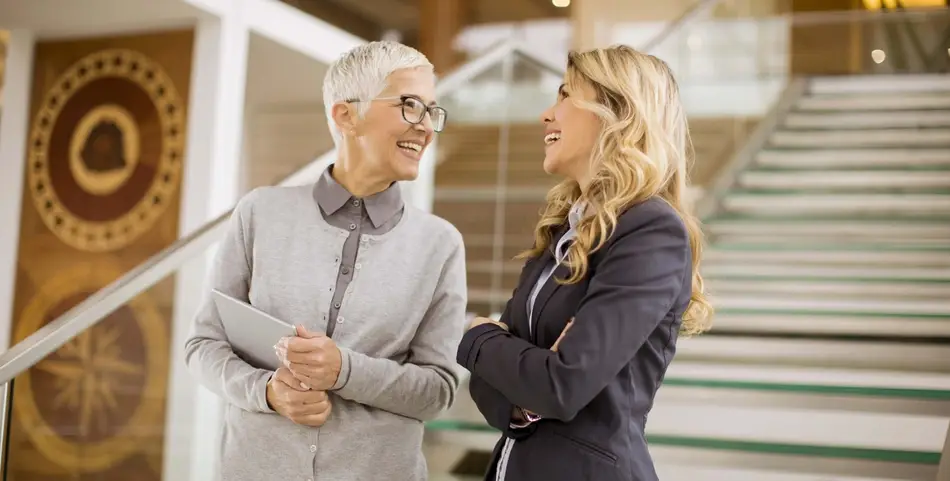 senior and young business women