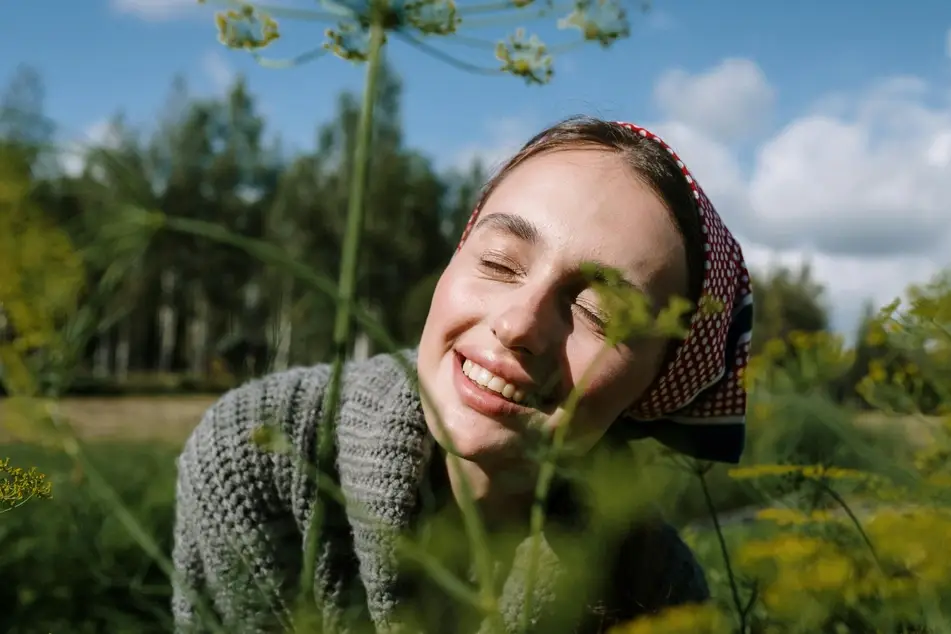 woman laying in tall grass