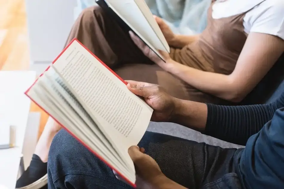 people reading books.