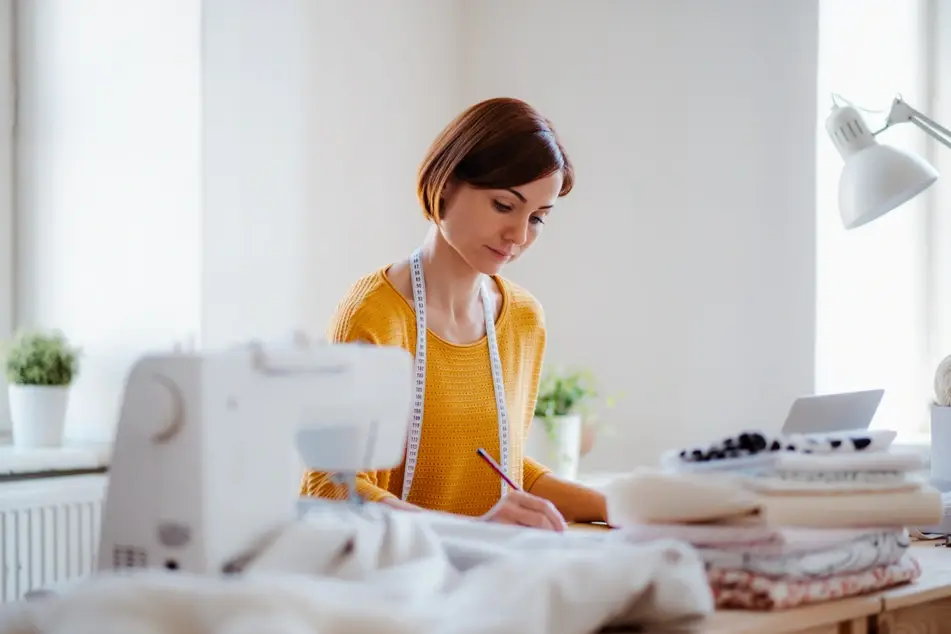 seamstress working in studio