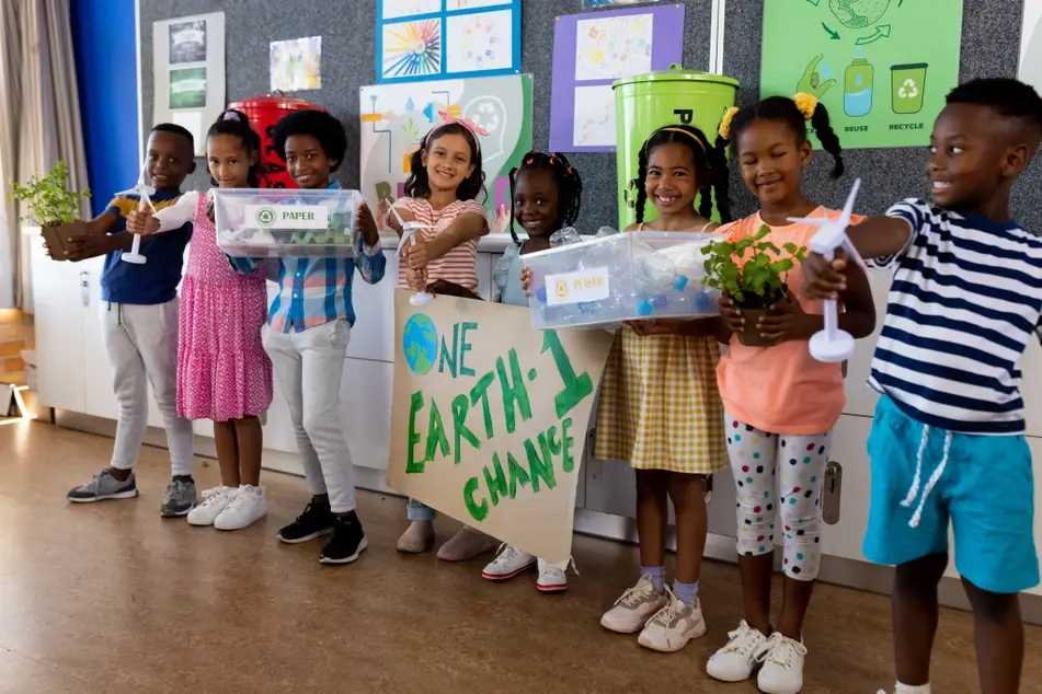 Group of school children celebrate Earth Day through various volunteer efforts.